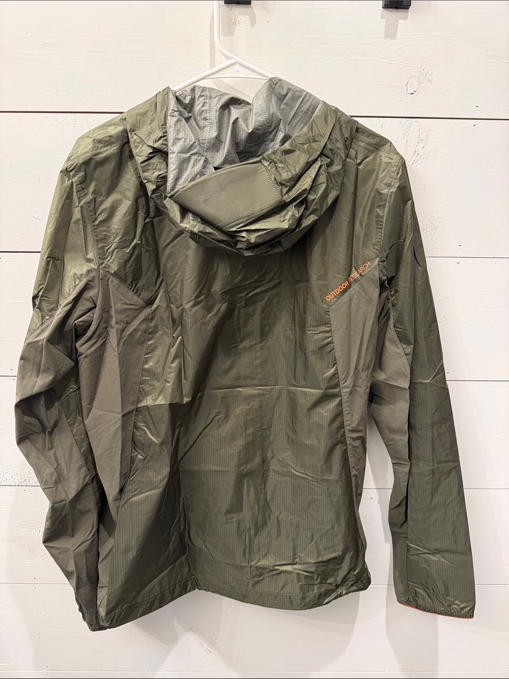 Outdoor Research Helium II jacket in green with orange zipper details. - Picture 5 of 7